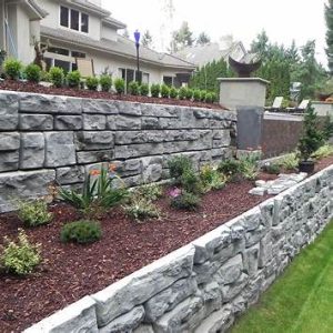 Stone retaining wall in a landscaped garden